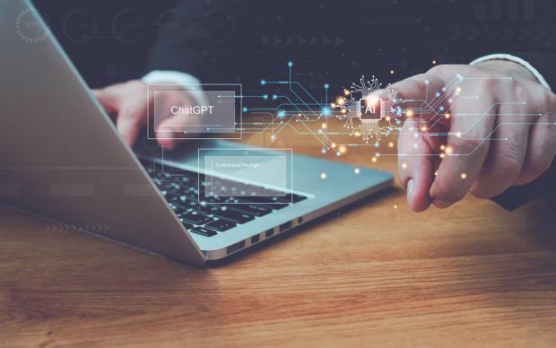 businessman using laptop with AI virtual graphic